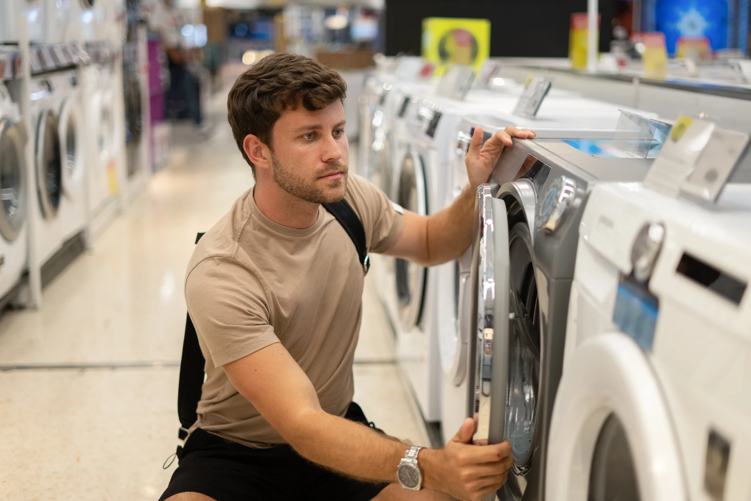 male-buying-new-washing-machine-2025-02-14-08-28-36-utc